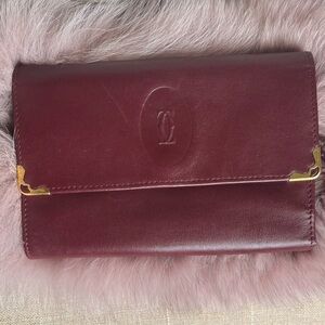 Cartier Burgundy Leather Wallet with gold accents in beautiful condition.